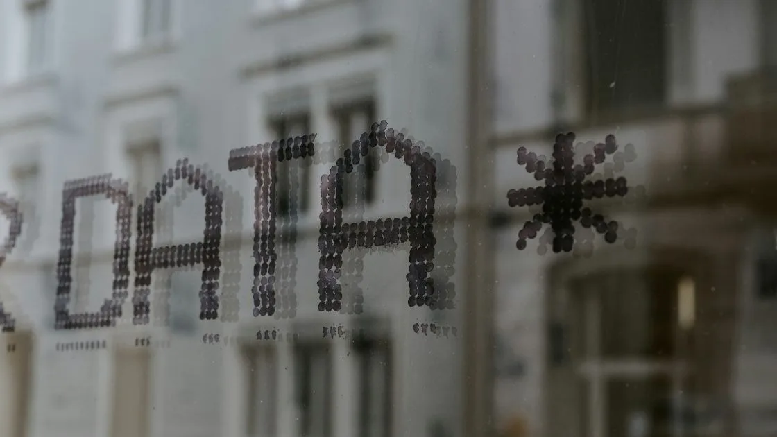 The word DATA spelled out on a glass office window